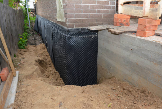 SJ Waterproofing Pros technician performing targeted Exterior Waterproofing assessment in Deerfield, MI